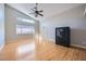 Bright bedroom with wood floors, lots of natural light, and modern ceiling fan at 3531 Barrel Bronco Ct, North Las Vegas, NV 89032