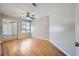 Bright bedroom with wood floors, ceiling fan, and mirrored closet doors at 3531 Barrel Bronco Ct, North Las Vegas, NV 89032