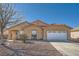 Charming single-story home with a two-car garage and low-maintenance landscaping at 3531 Barrel Bronco Ct, North Las Vegas, NV 89032