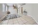 Spacious living room with tile floors, ceiling fan and natural light from the windows at 3531 Barrel Bronco Ct, North Las Vegas, NV 89032