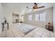 Inviting living room with tile floor, bright windows, and neutral paint scheme at 3531 Barrel Bronco Ct, North Las Vegas, NV 89032