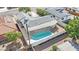 Aerial view of a backyard with a pool surrounded by neighboring homes, and a covered patio area at 3800 San Joaquin Ave, Las Vegas, NV 89102