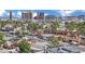 The Vegas skyline serves as a backdrop to these houses, complemented by mature trees and landscaping at 3800 San Joaquin Ave, Las Vegas, NV 89102