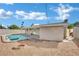 Spacious yard with an in-ground pool, complete with a back patio and fire pit perfect for enjoying the outdoors at 3800 San Joaquin Ave, Las Vegas, NV 89102