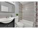 An elegant bathroom featuring modern tiles, a stylish vanity and a shower-tub combo at 3800 San Joaquin Ave, Las Vegas, NV 89102