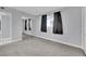 This is a spacious bedroom featuring plush carpet, a window and a mirrored closet at 3800 San Joaquin Ave, Las Vegas, NV 89102