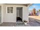 Inviting home entrance with a welcoming front door and colorful welcome mat and small desert landscaped yard at 3800 San Joaquin Ave, Las Vegas, NV 89102