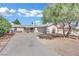 A single-story home features desert landscaping and a long driveway leading up to an attached two-car garage at 3800 San Joaquin Ave, Las Vegas, NV 89102