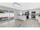 Bright kitchen with gray cabinets, stainless steel appliances, and sliding door access to the pool at 3800 San Joaquin Ave, Las Vegas, NV 89102