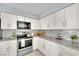 Bright kitchen with stainless steel appliances, granite countertops and white cabinets at 3800 San Joaquin Ave, Las Vegas, NV 89102