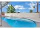 A beautiful in-ground pool ready for summer swims, highlighted by mature landscaping, and a sunny sky at 3800 San Joaquin Ave, Las Vegas, NV 89102