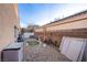 Low-maintenance backyard with gravel landscaping and a small putting green at 3882 Genoa Dr, Las Vegas, NV 89141