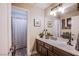 A stylish bathroom featuring a sink vanity with cabinets and a shower-tub combo with a shower curtain at 3882 Genoa Dr, Las Vegas, NV 89141