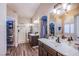 A spacious bathroom featuring dual sinks, a walk-in shower, and a view to the closet at 3882 Genoa Dr, Las Vegas, NV 89141