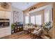 Bright breakfast nook with white shutters, cozy chairs, and decorative accents under a modern pendant light at 3882 Genoa Dr, Las Vegas, NV 89141