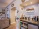 A stylish coffee bar featuring granite countertops, a mini-fridge, and decorative 'Coffee Time' accents at 3882 Genoa Dr, Las Vegas, NV 89141