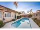 Sparkling backyard pool with lush landscaping and well-maintained surroundings at 3882 Genoa Dr, Las Vegas, NV 89141