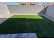 Enclosed backyard features green lawn space and a gravel border at 4238 Lemay St # 2, Las Vegas, NV 89115