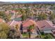 Aerial view of the home and neighborhood showcasing the tile roofs and landscaping at 4451 Tomer Ln, Las Vegas, NV 89121