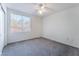 Bright bedroom featuring a window letting in natural light and soft carpeting at 4451 Tomer Ln, Las Vegas, NV 89121