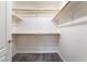 Walk-in closet with carpet flooring and wooden shelving at 4451 Tomer Ln, Las Vegas, NV 89121