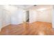 Bright living room featuring wood flooring, a large window, and a welcoming front door at 4451 Tomer Ln, Las Vegas, NV 89121