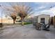 Expansive backyard features mature trees, a shed, outdoor furniture, and a manicured gravel area at 478 S Water St, Henderson, NV 89015