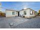 Home exterior showing a concrete patio, gravel landscaping, and a welcoming entrance at 478 S Water St, Henderson, NV 89015