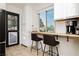 Bright kitchen with a breakfast bar and view of the neighborhood at 478 S Water St, Henderson, NV 89015