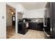 Modern kitchen featuring stainless steel refrigerator and white upper cabinets at 478 S Water St, Henderson, NV 89015