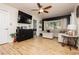 Open-concept living room with sleek black accent wall, hardwood floors, and ample natural light at 478 S Water St, Henderson, NV 89015