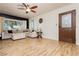 Bright living room with hardwood floors, modern furniture, and large windows at 478 S Water St, Henderson, NV 89015