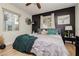 Cozy main bedroom featuring wood flooring and a ceiling fan at 478 S Water St, Henderson, NV 89015