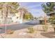 Gated community entrance with maintained landscaping and community buildings visible at 4877 S Torrey Pines Dr # 202, Las Vegas, NV 89103