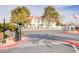 The entrance to the community features manicured landscaping, gated access, and a view of the buildings at 4877 S Torrey Pines Dr # 202, Las Vegas, NV 89103