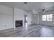 Living room featuring a decorative fireplace and modern gray floors at 4877 S Torrey Pines Dr # 202, Las Vegas, NV 89103