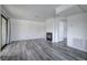 Living room featuring a decorative fireplace and modern gray floors at 4877 S Torrey Pines Dr # 202, Las Vegas, NV 89103