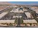 Aerial view showcasing the city's shopping centers, highway, and distant mountains at 501 Proud Eagle Ln, Las Vegas, NV 89144