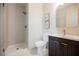 Modern bathroom featuring a walk-in shower, toilet, and vanity with stylish fixtures at 501 Proud Eagle Ln, Las Vegas, NV 89144