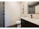 Modern bathroom featuring a sleek vanity with a white countertop and a gray tiled shower at 501 Proud Eagle Ln, Las Vegas, NV 89144