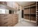 Organized walk-in closet with custom shelving, drawers, and ample storage space at 501 Proud Eagle Ln, Las Vegas, NV 89144