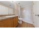 Bathroom featuring granite vanity, modern faucet, and shower-tub combo with tiled surround at 5855 Valley Dr # 2170, North Las Vegas, NV 89031