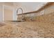 Close up on a stunning granite kitchen countertop with a modern faucet and neutral backsplash at 5855 Valley Dr # 2170, North Las Vegas, NV 89031