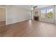 Spacious living room featuring light wood floors, a fireplace, and a large window for natural light at 5855 Valley Dr # 2170, North Las Vegas, NV 89031