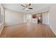 Open-concept living room featuring light wood floors and seamlessly flowing into the adjacent kitchen at 5855 Valley Dr # 2170, North Las Vegas, NV 89031