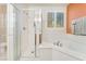 Bright bathroom with a shower, soaking tub, and natural light at 5873 Wildhorse Ledge Ave, Las Vegas, NV 89131