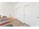 Bedroom featuring carpet and multiple closets at 5873 Wildhorse Ledge Ave, Las Vegas, NV 89131