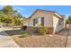 Single-story house showcasing stone accents, an attached garage, and desert landscaping at 5873 Wildhorse Ledge Ave, Las Vegas, NV 89131