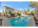 Backyard swimming pool with surrounding desert plants and a private fence at 5873 Wildhorse Ledge Ave, Las Vegas, NV 89131