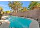 Backyard pool with a concrete deck and block wall fence at 5873 Wildhorse Ledge Ave, Las Vegas, NV 89131